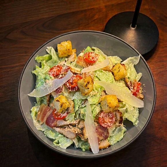 A Caesar salad with parmesan shavings at Cloud Caf&eacute; & Bar.