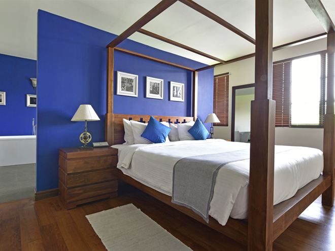 The Luxury Honeymoon Suite from the doorway, the bath beyond the bed.