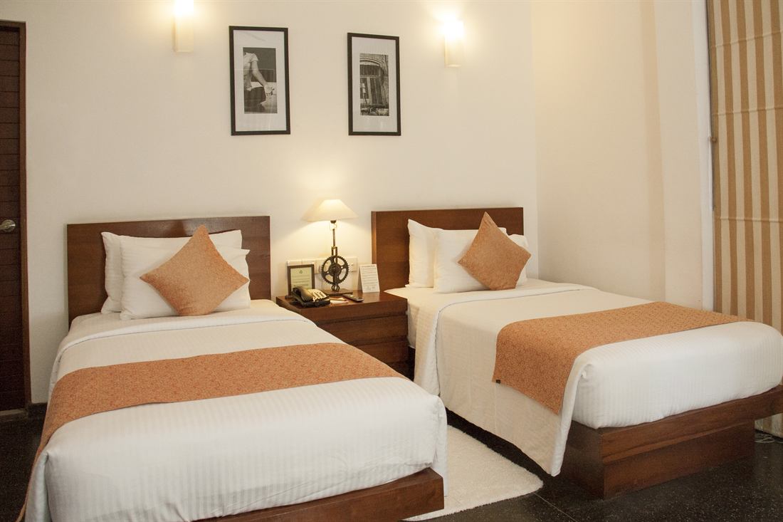 A Deluxe Twin room seen from the door, beds side by side.