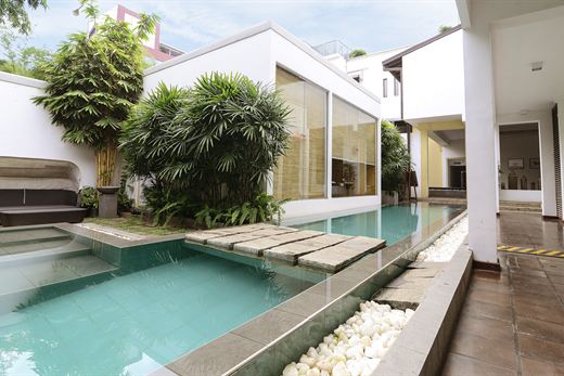 The pool at Colombo Court running the length of the garden.