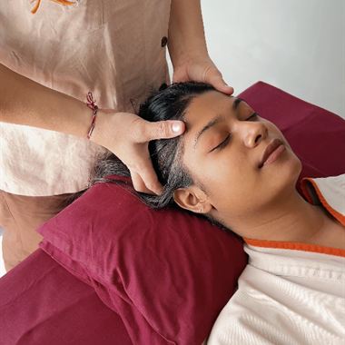 A therapist working through a head and scalp massage at The Court Spa.
